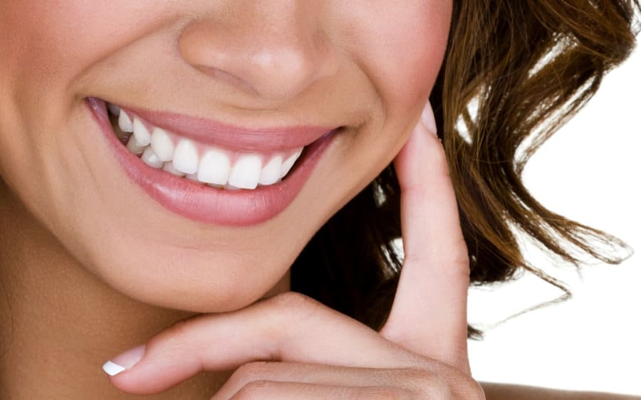 Close up of a woman smiling.