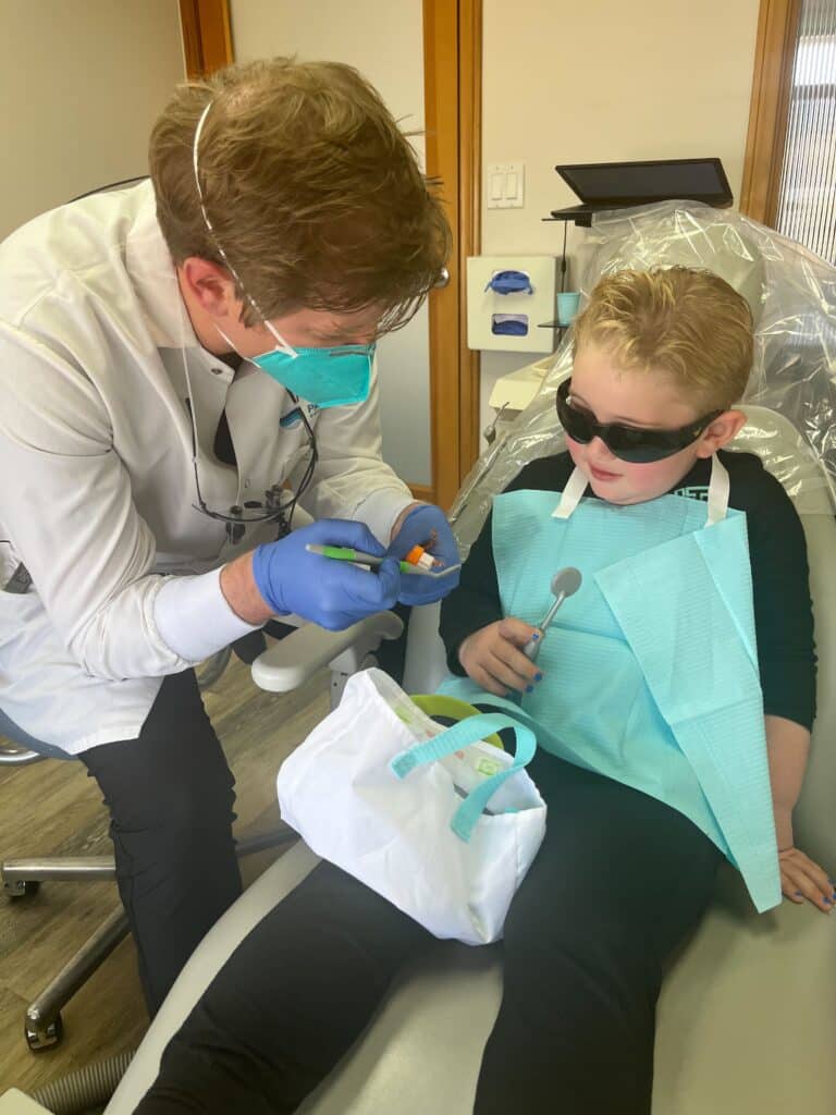 Dr, Carmody interacting with a child patient at the end of their checkup